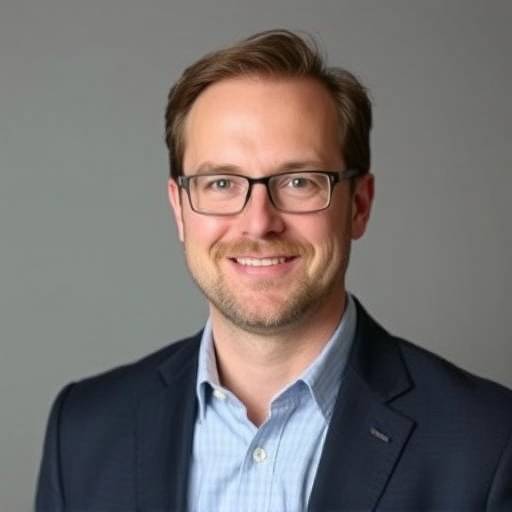 Headshot of Michael Reynolds, Academy Administrator, looking professional and approachable.